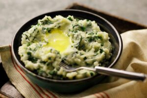 Colcannon Mashed Potatoes are not only delicious but the green color captures the spirit of its Irish heritage.